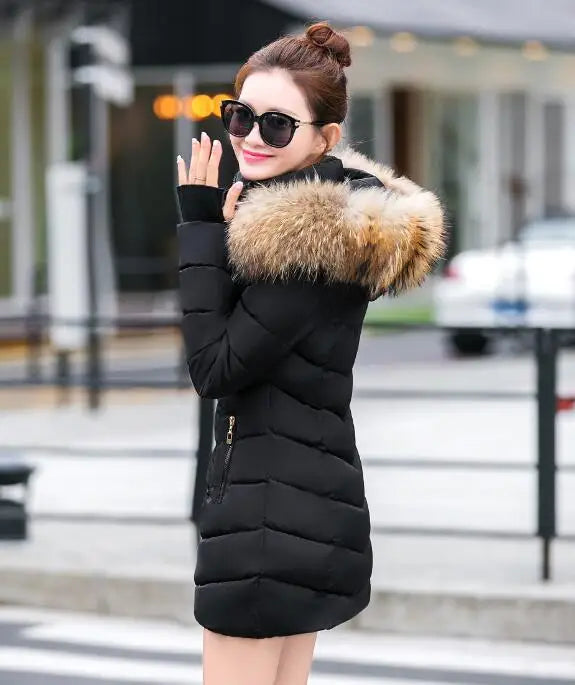 Cece - Lange Pelzjacke mit Puffs